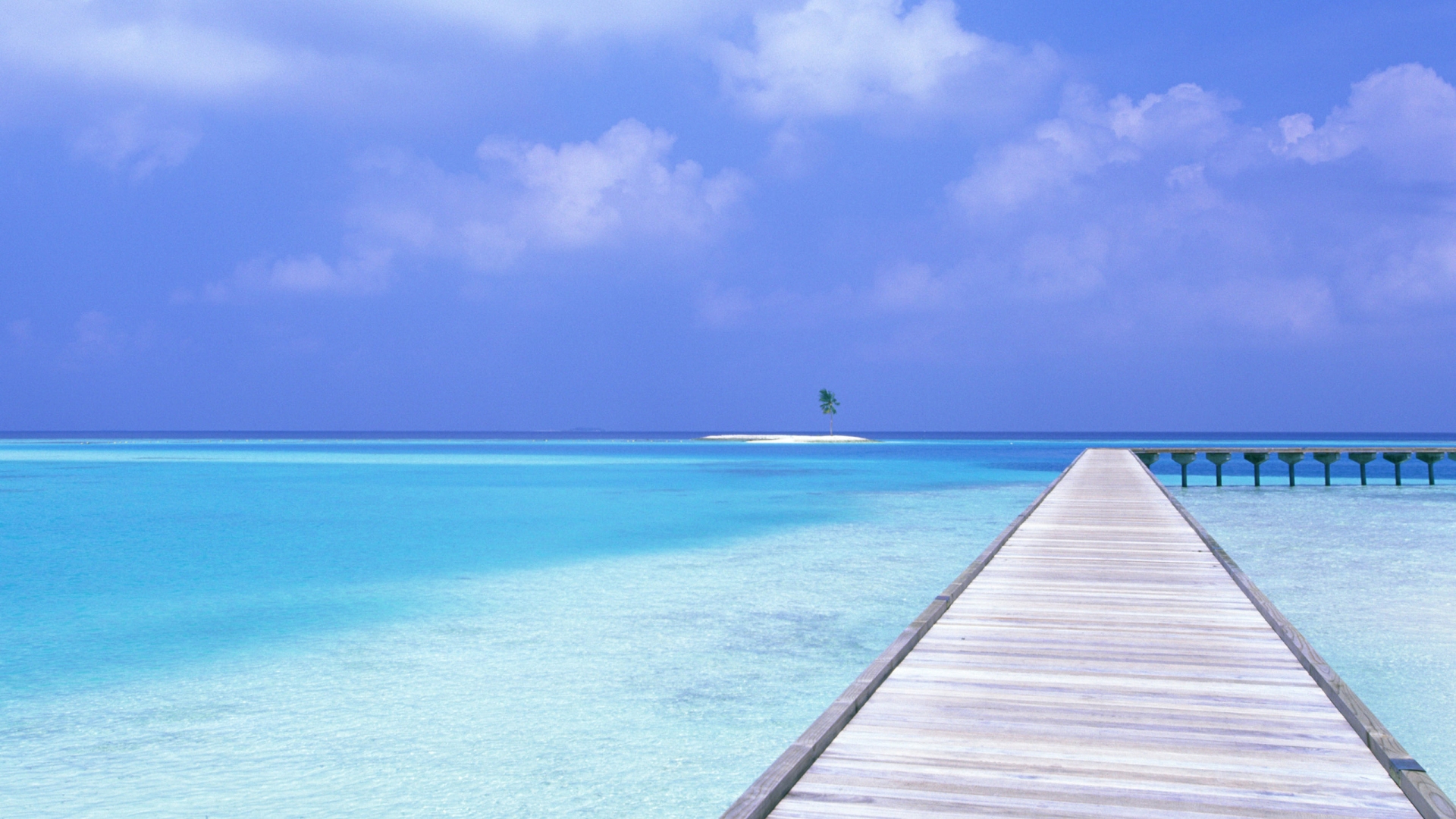 Pier Heading Out From a Maldives Beach 16:9