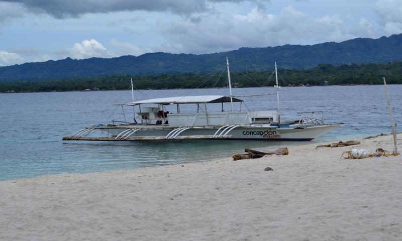 Conception Explorer Waiting on Beach at Canigao Island, Philippines