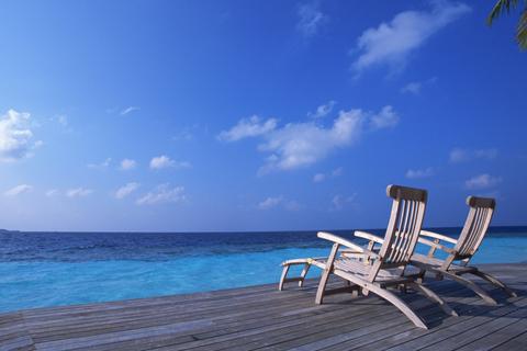 Deck Chairs On The Maldives Beach