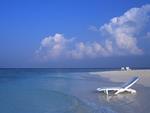 A Deck Chair in the Water on a Maldives Beach 4:3