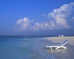 A Deck Chair in the Water on a Maldives Beach 5:4